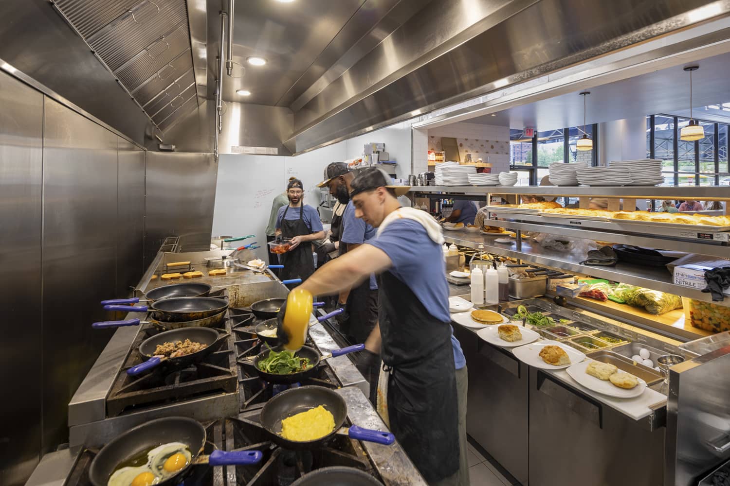 kitchen staff cooking food at the Buttered Biscuit