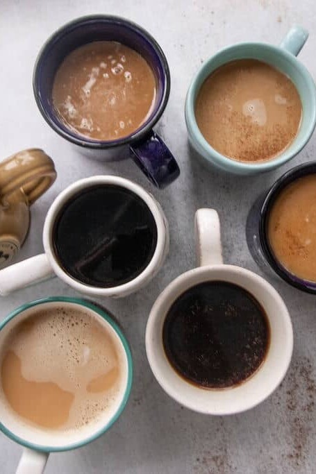 7 mugs with hot drinks