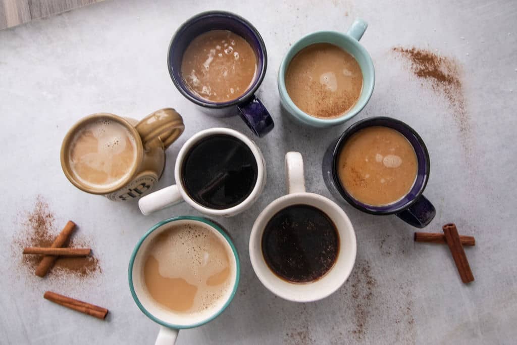 7 mugs with hot drinks