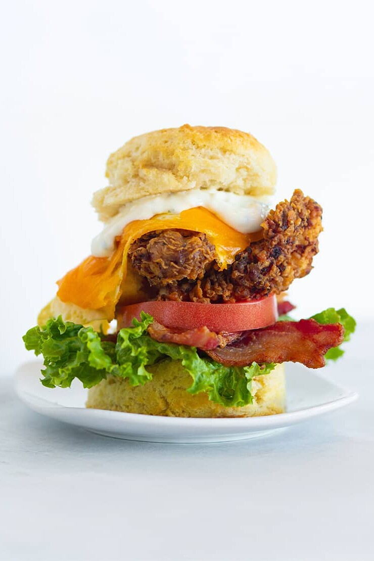 eureka sandwich with chicken, bacon, lettuce, tomato and cheddar on a biscuit