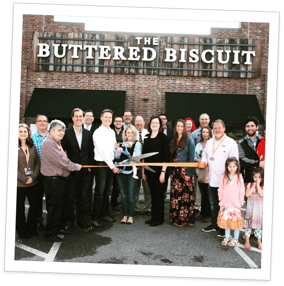 crowd at the ribbon cutting for the Buttered Biscuit restaurant
