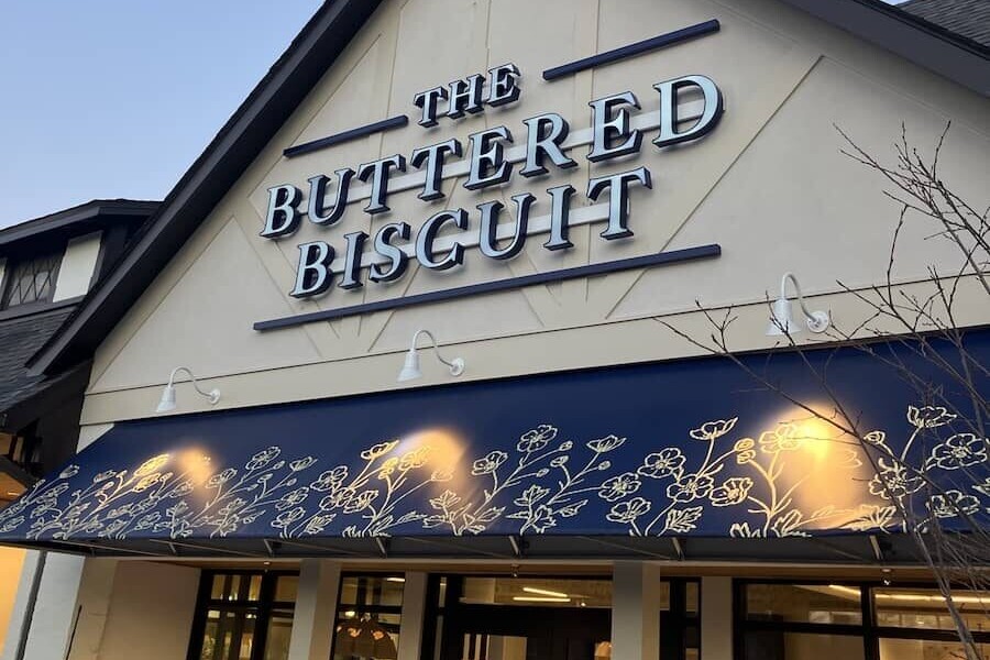 the front door and sign of The Heights Buttered Biscuit building