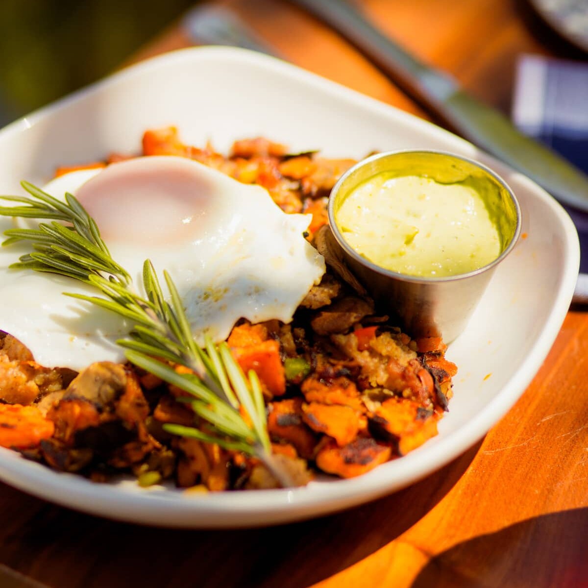 Eggs over easy, red skin potatoes, and handcrafted butter.
