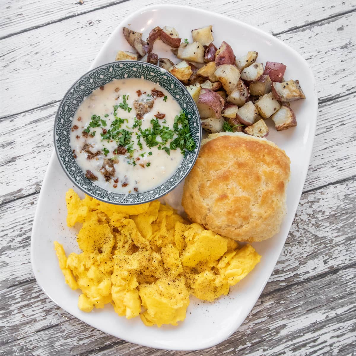 A biscuit, scrambled eggs, red skin potatoes, and the best sausge gravy.