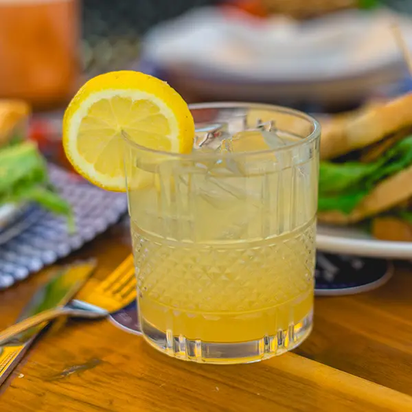 yellow cocktail with orange slice